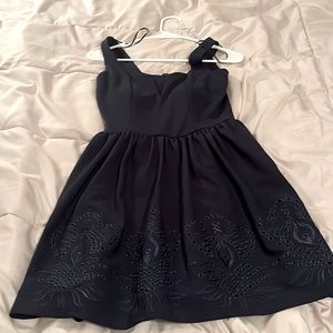 “Mi Ami” navy boutique mini dress with cutout detail